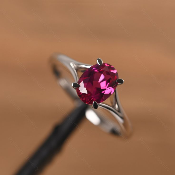 It is a ruby ring. The main stone is 6mm*8mm oval cut, weight about 1.75 carats. The basic metal is sterling silver and plated with rhodium. To change the metal to a solid gold (white/rose) or platinum is also available, please ask for a quotation if you want. You can also go to my shop Home for more elegant rings: https://www.etsy.com/shop/godjewelry?ref=hdr_shop_menu More rings: https://www.etsy.com/shop/godjewelry?ref=l2-shop-header-avatar Customization is always welcome and please feel free Classic Oval Ruby Ring In 14k White Gold, Oval White Gold Ruby Promise Ring, Oval Ruby Solitaire Jewelry, Oval Lab-created Ruby Promise Ring, Modern Sterling Silver Ruby Ring For Anniversary, Modern Silver Ruby Ring With Oval Shape, Oval Ruby Ring With Prong Setting In Sterling Silver, Oval Ruby Ring In White Gold Sterling Silver, Oval Ruby Ring With Center Stone In Sterling Silver