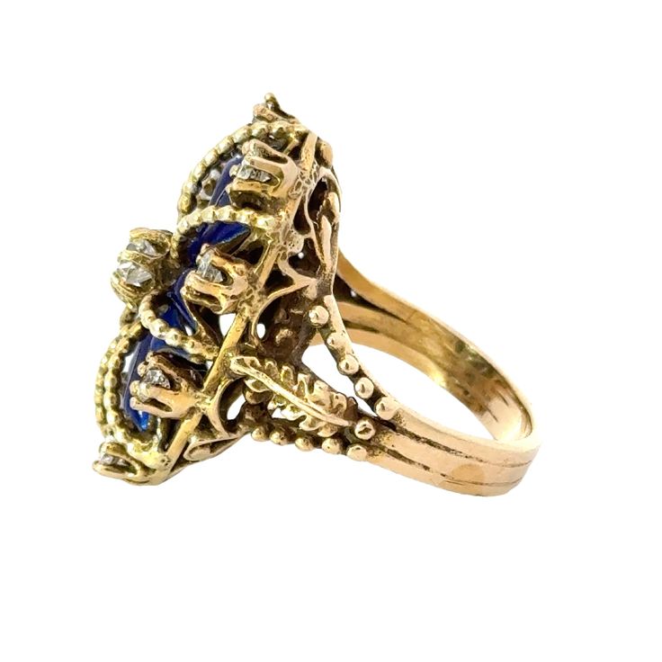 This antique ring in 14K yellow gold is regal in design, featuring a crown-like blue enamel and sparkling diamonds. Crafted with intricate details, this piece exudes a timeless elegance fit for royalty. Perfect for those seeking a vintage touch to their jewelry collection. Jewelry Style : RingMetal Type : 14K Gold Diamond : 9 Old Euro Cut , Approximately 1.0 ctwBlue EnamelApproximately 1.25" long x .80" wideRing Size : 7 : Can be sized by your local jewelerestate piece, sold as is, all weights a Blue 14k Gold Enamel Ring For Formal Events, Formal Blue Enamel Ring In 14k Gold, Blue 14k Gold Enamel Ring For Formal Occasions, Wedding Enamel Ring With Diamond Accents, Vintage Diamond Enamel Round Ring, Vintage Round Diamond Enamel Ring, Vintage Blue Cluster Ring With Prong Setting, Vintage Blue Sapphire Ring With Diamond Accents, Elegant Enamel Ring With Diamond Accents For Wedding