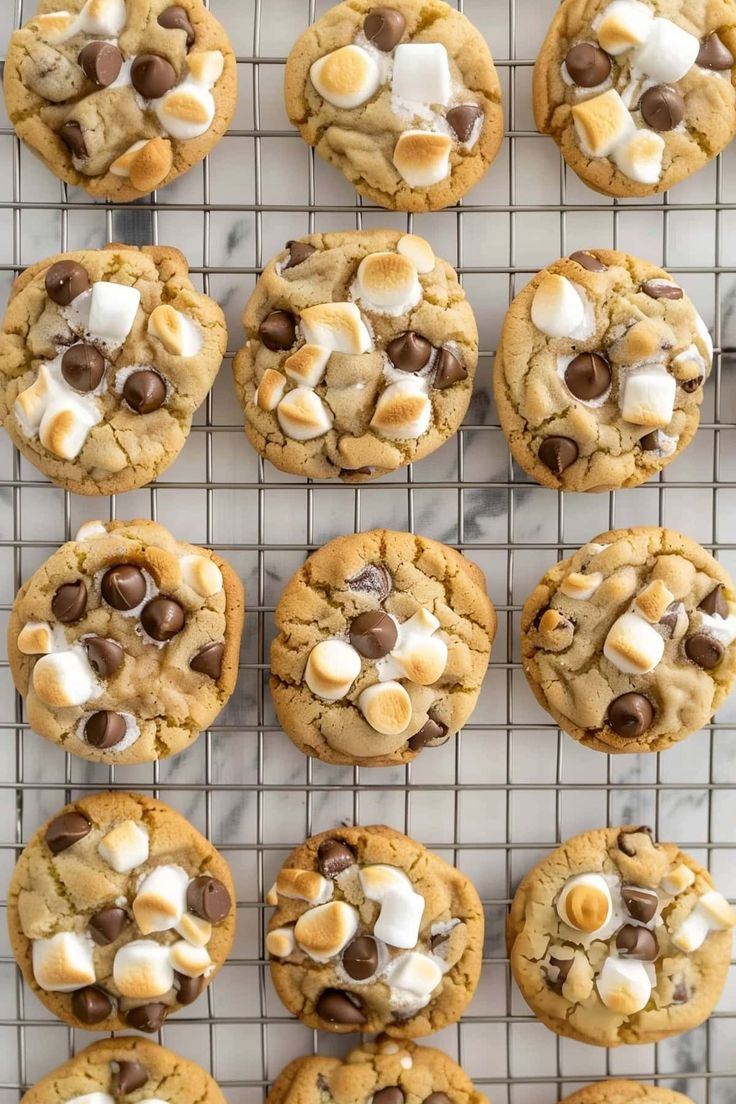 cookies with marshmallows and chocolate chips on a cooling rack