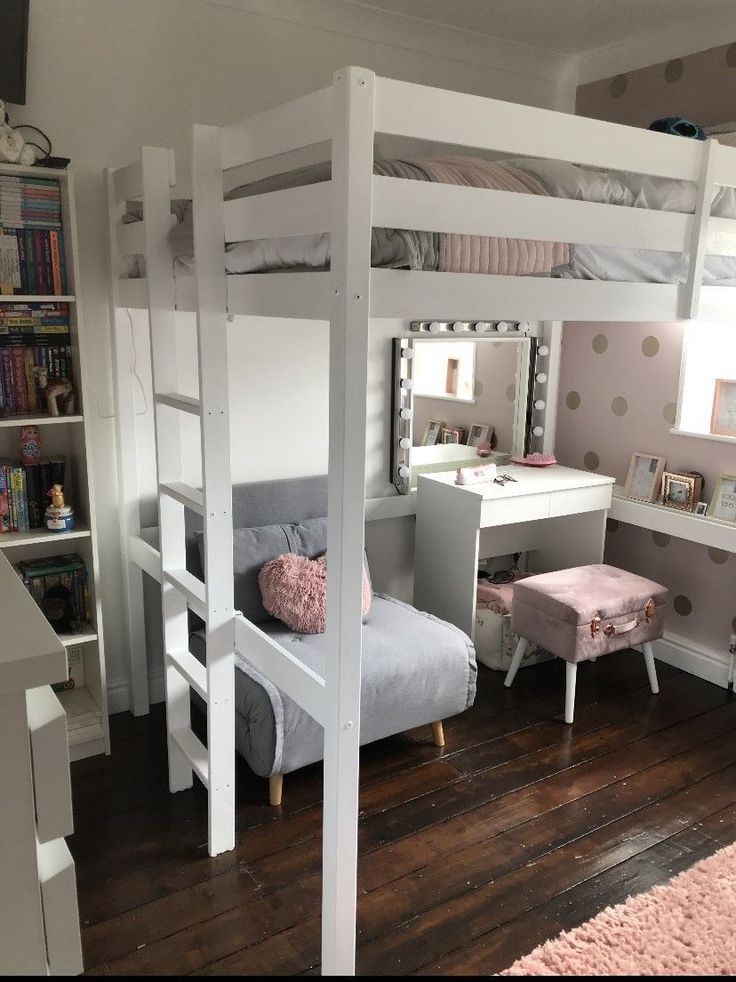 a white bunk bed sitting next to a desk and chair