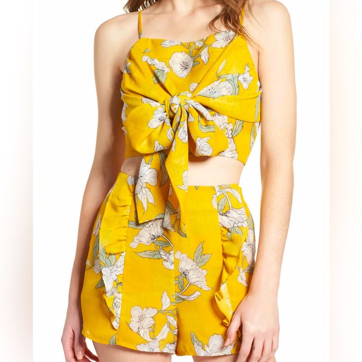 Chriselle X J.O.A. Wrap Crop Top & Ruffle Shorts~ Color/Pattern: Quince Blossom Yellow Fully Lined Material: 100% Polyester Size: Small Shorts Waist: 14” No Stretch Crop Top Has A Zipper On Back As Well As A Hook & Eye Closure. The Wrap Ties Can Be Fashioned So Many Ways For A New Look Every Time You Wear It. Shorts Have Slant Pockets. Side Zipper With Zipper/Hook & Eye Closure. Fashionable And Feminine!! New Without Tags ~ Never Worn ~ No Flaws. Chriselle Lim Designed This As Part Of A Collecti Matching Set Tops For Spring And Summer, Yellow Sleeveless Jumpsuits For Spring, Sleeveless Yellow Jumpsuits And Rompers For Spring, Spring Matching Set Tops, Yellow Beachwear Matching Set, Yellow Sleeveless Summer Set, Casual Yellow Ruffled Sets, Yellow Sleeveless Sets For Summer, Sleeveless Yellow Summer Set