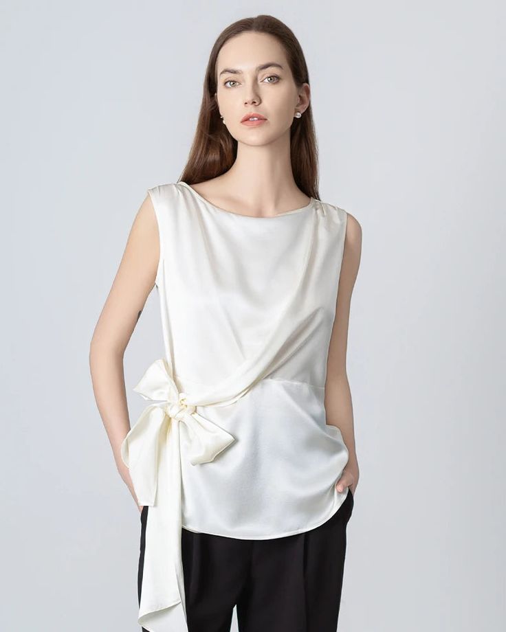 Type: Women's Silk Blouse.Material: 22 Momme Luxury Mulberry Silk.Details: Classic Solid Color, Designed Wrap&Sleeveless, Regular Fit. Meet our sleeveless silk blouse, a versatile essential with a unique twist. Featuring a waist ribbon that can be worn down or tied into various knots, this wrap top effortlessly adapts to any occasion. Crafted from luxurious silk fabric, it adds an elegant touch to your look, whether you're at the office or out for a night on the town. SIZE: CM / INCH SIZE Bust S Elegant Silk Tops With Bow Detail, Versatile Silk V-neck Top, Elegant Silk V-neck Tank Top, Sleeveless Silk Blouse, Silk V-neck Camisole With Adjustable Straps, Black Silk V-neck Camisole, Silk T Shirt, Blouse Material, Office Casual