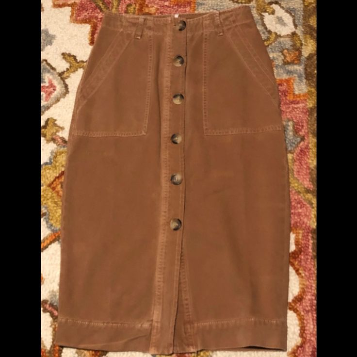 Free People Rustic Denim Skirt Very Cute Button Down Denim Shirt, Tapered And Very Narrow At Bottom. Pencil Type Shirt. Size 2 Color Rustic/Brown Waist 13” X2= 26” Length 27 1/2 Bottom Of Skirt 16” Broad Slanted Pockets On Front Only The Shirt Is For Sale Casual Fall Skirt With Button Zip Fly, Button-up Utility Bottoms For Fall, Utility Button-up Bottoms For Fall, Fall Denim Skirt With Button Closure For Work, Buttoned Denim Skirt For Workwear In Fall, High Waist Buttoned Denim Skirt For Fall, Brown Buttoned Skirt For Spring, Fall Workwear Denim Skirt With Buttons, Buttoned Cotton Denim Skirt For Fall