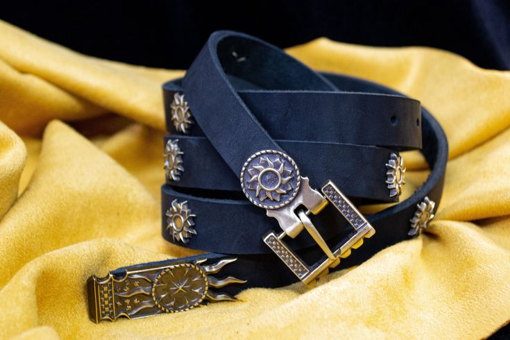 The Nilfgaard Belt is a true work of art that embodies the richness and sophistication of the Nilfgaardian Empire.  A special feature of the belt is its unique buckle, strap-end and ten mounts made of brass in the style of Nilfgaard - the richest and most powerful empire of the Continent, known for its desire for luxury and grandeur. The brass elements are covered with a pattern that recalls the glorious times of this legendary state, emphasizing the status of its owner and his love for the world of the Witcher. This belt will be an ideal accessory for fans of the Witcher universe and connoisseurs of high-quality and stylish things and will also be an excellent gift for friends and family who share your passion for the Witcher and appr If you have any questions, please contact us and we wi Luxury Adjustable Belt With Brass Buckle, Luxury Adjustable Brass Buckle Belt Buckles, Suspender Belt, The Witcher, Most Powerful, Suspenders, Gifts For Father, Leather Belt, Special Features