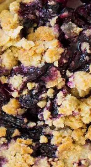 blueberry cobbler with crumbled topping in a bowl