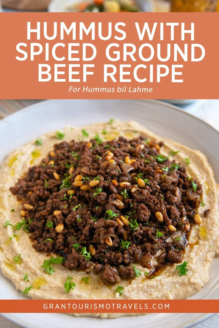 hummus with spiced ground beef recipe for hummus bil lamne on a white plate