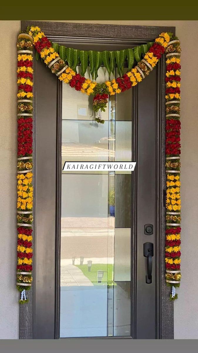 an entrance to a building decorated with flowers