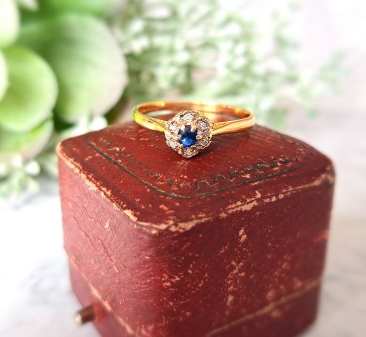 Size R (EU 59, US 9) Free Resizing Available - please message or email info@sobellejewellery.com Assay Office Birmingham, Makers Mark W.E.G c.1910. Weight: 2.6g Sapphire: 2.4mm Diamonds: 6 x 0.8mm Condition:  Good, clean vintage condition.  All items have a full professional clean and polish upon dispatch. Please message for further information, photos, videos etc. My items are all vintage so please study the photographs where I try to show as much detail as possible. Any damage or obvious imperfections will be clearly stated. All items come gift packaged. Vintage Yellow Gold Diamond Ring With Birthstone, Vintage Yellow Gold Cluster Ring With Birthstone, Vintage Birthstone Cluster Ring, Vintage Yellow Gold Sapphire Ring For Gift, Vintage Cluster Ring With Birthstone For Gift, Vintage Birthstone Cluster Ring As A Gift, Victorian Cluster Ring With Center Stone As Gift, Diamond Flower Ring, Edwardian Jewelry