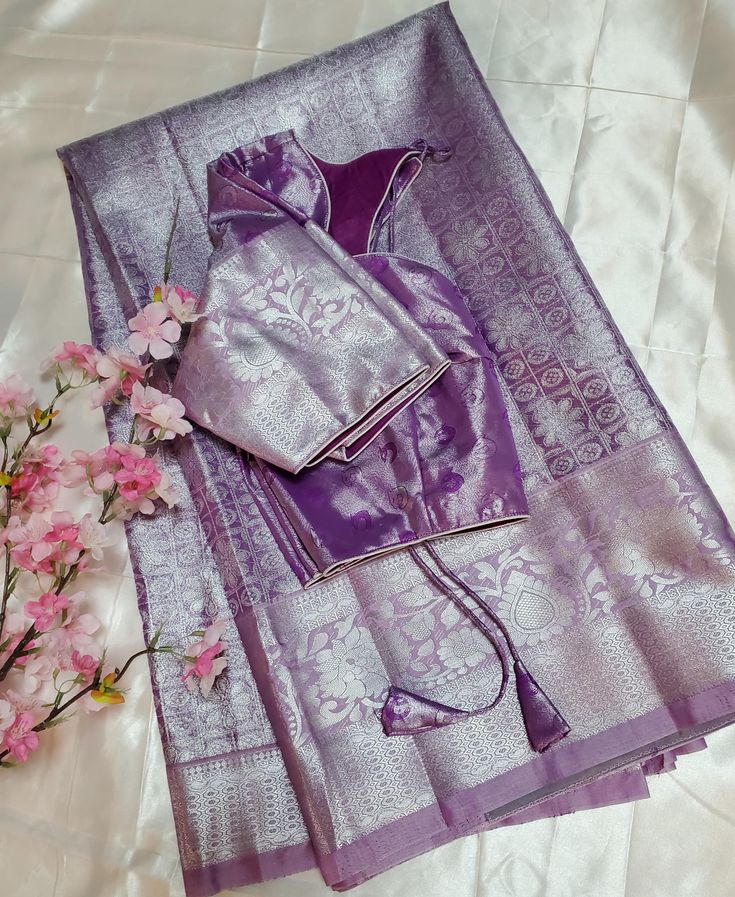 Semi kanchi pattu saree with stitched blouse  color : purple color(pastel clrs) blouse measurements : fits up to 40 inches we can customize the blouse for your body measurements  Disclaimer : There might be little color variation because of photography and gadget settings, zari folding's and Thread outcomes are not considered as damage. Purple Unstitched Blouse Piece For Puja, Lavender Blouse Piece With Zari Work For Saree, Traditional Lavender Blouse Piece With Pallu, Lavender Saree Blouse Piece For Festivals, Festive Lavender Saree With Unstitched Blouse, Purple Katan Silk Blouse Piece With Pallu, Semi-stitched Purple Saree With Unstitched Blouse, Purple Banarasi Silk Blouse Piece For Puja, Purple Semi-stitched Saree With Unstitched Blouse