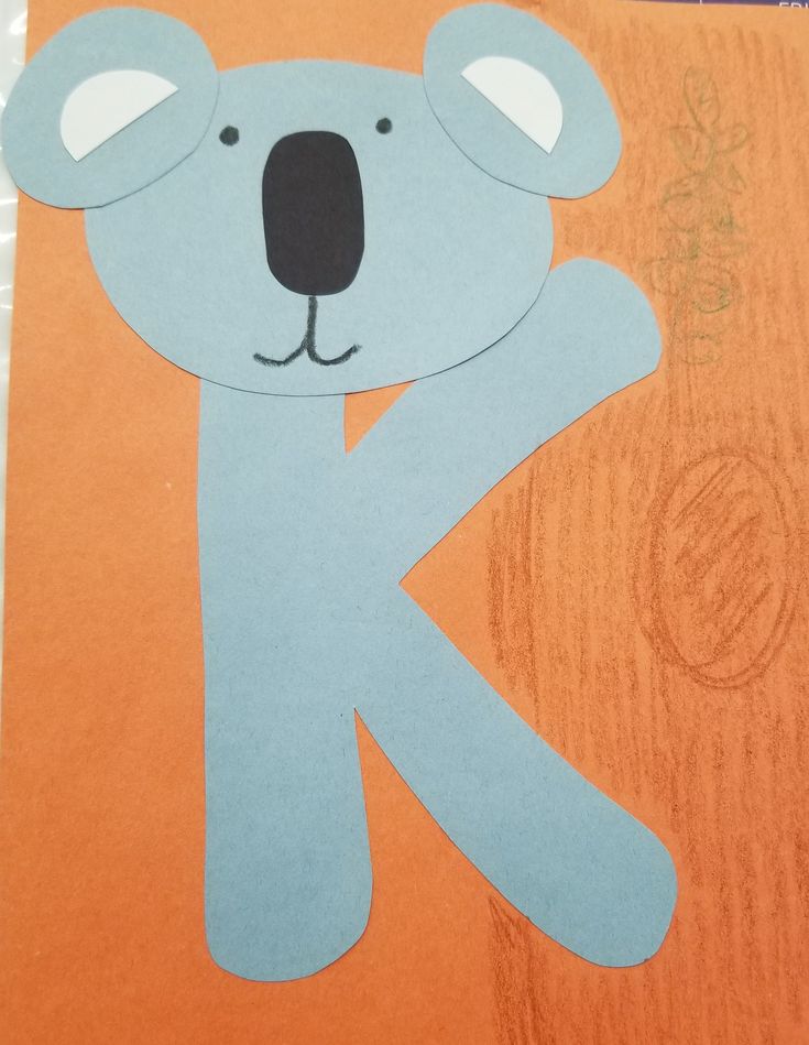 a paper cut out of a koala with the letter k on it's face