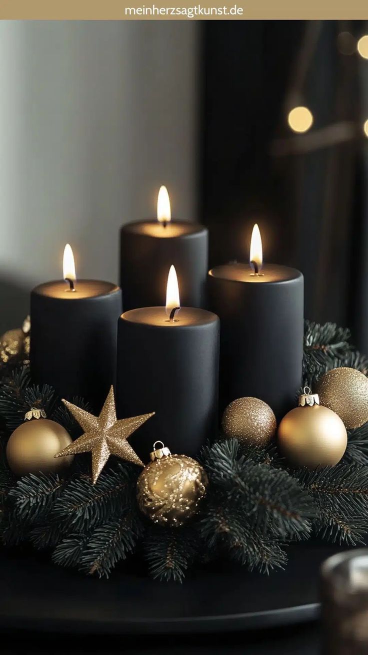 three lit candles sitting on top of a table next to christmas balls and ornaments in front of a window