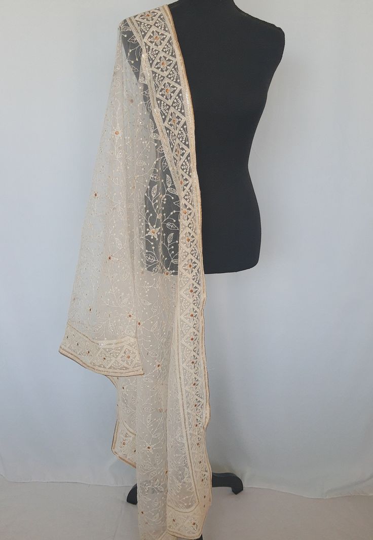 Rich,elegant ,attractive premium Dupatta with overall Chikankari work to enhance your beauty and to compliment your ethnic attire.Dupatta has gold piping border and has golden soft micro sequins  attached and has gold embroidery work . Color Off white Length 2.4 metres Fabric Net Elegant Gold Dupatta With Resham Embroidery, Unstitched Elegant Churidar With Embroidered Border, Elegant Unstitched Churidar With Embroidered Border, Long Embroidered Dupatta For Eid, Embroidered Long Dupatta For Eid, Embroidered Long Dupatta For Diwali, Long Embroidered Dupatta For Diwali, Long Embroidered Dupatta For Wedding, Elegant Gold Unstitched Suit With Dupatta