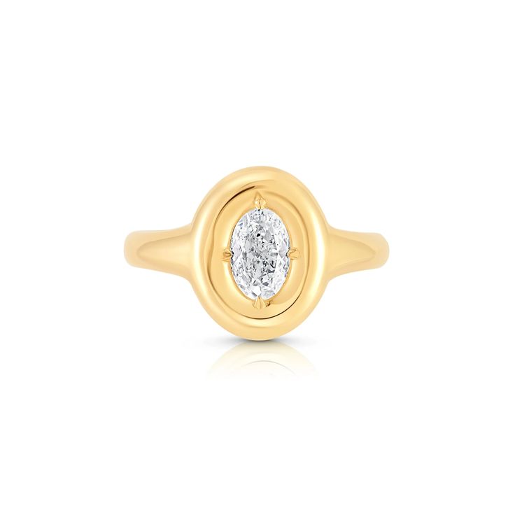 a yellow gold ring with a diamond in the center