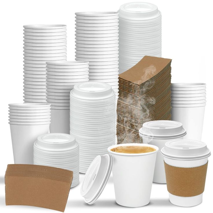 a stack of white coffee cups next to stacks of brown paper plates