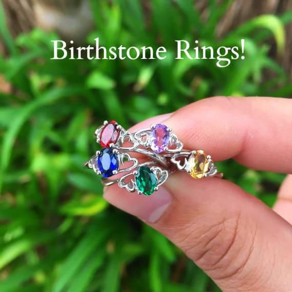 These are beautiful sterling silver birthstone rings, each handmade with the gemstone of your choice. The center gemstone is set in between two hearts, which represent your heart and theirs. This ring is a perfect gift for a best friend, a mother, or even a promise ring to your girlfriend. She'll absolutely love the way it sparkles! They are also comfortable for everyday wear! * Made with Sterling Silver * The Best Colored Gemstones * Free Stylish Ring Box! We personally hand select our gemstone Amethyst Ring With Cubic Zirconia Accents For Anniversary, Heirloom Style Gemstone Jewelry For Gifts, Handmade Stackable Rings For Promise Fine Jewelry, Heirloom Gemstone Jewelry For Gifts, Handmade Fine Jewelry Stackable Promise Rings, Handmade Fine Jewelry Stackable Rings For Promise, Heirloom Style Birthstone Jewelry, Heirloom Style Round Birthstone Jewelry, Ruby Birthstone Promise Ring