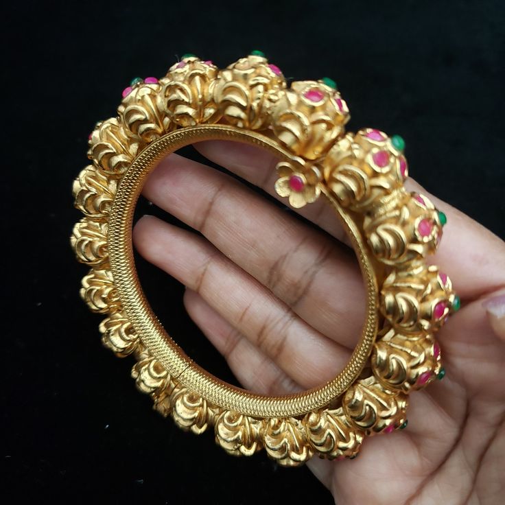 "* Handcrafted Gold Plated Bangle Set, it opens up by unlocking the screw and makes to easy to wear. * High Quality 22 K Gold Plated Adjustable 2 pc bangle set; * Available Size- 2.6 ( Inner Diameter: 2.35\"), Openable kada. * Sold as a set of 2 bangles Gorgeous gold-plated bangle/ bracelet best exemplifies the careful craftsmanship done on it -- a specialty at Nemali Jewelry. It has a special tone of elegance attached to it. The intricate handmade design of the bangle/bracelet set gives it a fr Temple Jewelry For Rituals With Openable Details, Handmade Temple Jewelry Bangle For Celebration, Green Meenakari Bracelets For Celebration, Temple Jewelry Bangle For Celebration, Unique Bangle For Festivals, Elegant Handmade Puja Bangle, Green Temple Jewelry Bracelets With Cutdana, Elegant Handmade Bangle For Puja, Green Temple Jewelry Bangle For Diwali