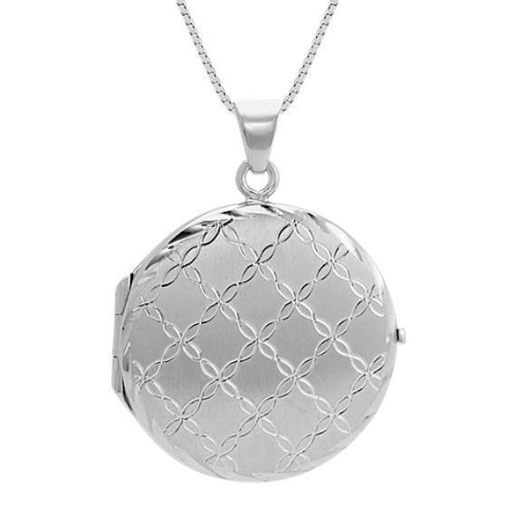 The locket is beautifully etched with a quilted stitch design over a satin finish for a soft textured feel. This locket measures 1 and 1/2 inches long  is crafted of quality sterling silver and hangs from a matching adjustable 20-inch box chain. Personalize this piece by having your own unique message engraved upon the back. For more information on engraving  Live Chat or call an online customer service representative at 1-866-467-4263  or visit one of our store locations. Classic Silver Engraved Locket Necklace, Classic Silver Locket Necklace With Round Pendant, Elegant Etched Oval Pendant Locket Necklace, Formal Sterling Silver Locket Necklace With Polished Finish, Formal White Gold Engraved Locket Necklace, Formal White Gold Round Locket Necklace, Silver Engraved Round Locket Necklace, Silver Round Engraved Locket Necklace, Elegant Engraved Round Disc Locket Necklace