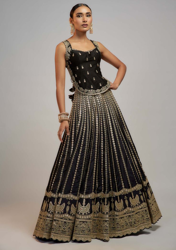 Editor's Note Captivate in the allure of heritage embroidery with this stunning lehenga, adorned in exquisite marodi and gota work, showcases vertical floral lines converging at the waist for a... Embellished Black Palazzo Set For Reception, Black Embellished Palazzo Set For Reception, Designer Embellished Black Palazzo Set, Black Embellished Palazzo Set For Diwali, Designer Black Embellished Sets, Embellished Black Bollywood Palazzo Set, Traditional Embellished Black Palazzo Set, Elegant Black Embellished Palazzo Set, Elegant Black Floor-length Palazzo Set