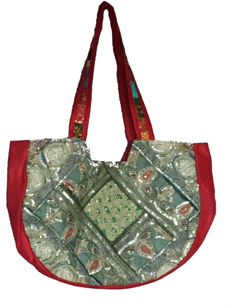 Patchwork tote bag may be covered in sari fabric, embroidery, sequins, mirrors, rhinestones, and/or metallic thread. 18x13x4 inches. 12 inch strap drop. Zipper top, Inside zipper pocket. Each bag is unique, please see photo. Handmade in India. The weaving irregularities and shade variations are characteristic of the fabric and in no way to be taken as defects. Festive Rectangular Bag With Mirror Work, Bohemian Potli Bag With Mirror Work For Festive Occasions, Rectangular Bags With Mirror Work For Diwali, Festive Rectangular Potli Bag With Mirror Work, Festive Rectangular Shoulder Bag With Mirror Work, Rectangular Embellished Shoulder Bag For Festivals, Bollywood Style Rectangular Bags With Zari Work, Festival Bag With Mirror Work, Embellished Rectangular Shoulder Bag For Festivals