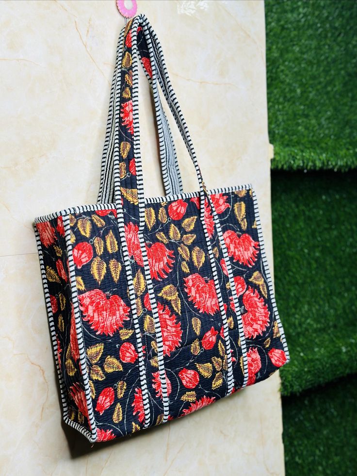 The Indian Hand Block Printed Cotton Quilted Women's Handbags from Rajasthan India. This Handbag is completely Indian Printed on good quality cotton. Cotton quilted travel Bag made by Indian Artisans, this cotton quilted shopping bag is totally unique and multi purpose. Use this for your grocery or as a travel bag. Perfect to suit all. Item :- Cotton Handbag Material: 100% Cotton Size :- Medium Size  Pattern: Floral Print Was Care - Home Washable Style: Tote Bag Color :- As Picture Shown Wash Ca Pouch Bag With Zipper For Shopping, Shopping Pouch Bag With Zipper, Shopping Bags With Zipper Pouch, Rectangular Beach Bag With Removable Pouch For Daily Use, Shopping Bag With Zipper Pouch, Large Black Box Bag For Everyday Use, Red Rectangular Beach Bag For Everyday Use, Rectangular Zipper Pouch Bag For Travel, Square Box Bag With Handles For Daily Use