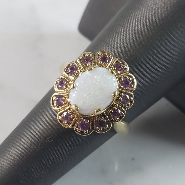 A Womens Vintage Estate 10k Yellow Gold Opal Amethyst Ring. The Ring Weighs 4.5g, And Is A Size 6.75. Opal Stone Is Surrounded By Amethyst Stones. This Makes A Lovely Gift For That Someone Special. Any Questions, Please Do Not Hesitate To Ask. Be Sure To Check Out Some Of My Other Great Items Up For Sale. Thank You. White Amethyst Ring For Anniversary, Elegant White Amethyst Ring Gift, White Amethyst Gemstone Ring For Anniversary, Elegant Purple Opal Ring For Anniversary, Elegant Purple Opal Anniversary Ring, White Amethyst Ring For Promise, White Amethyst Promise Ring, White Amethyst Jewelry For Formal Occasions, Formal White Amethyst Jewelry