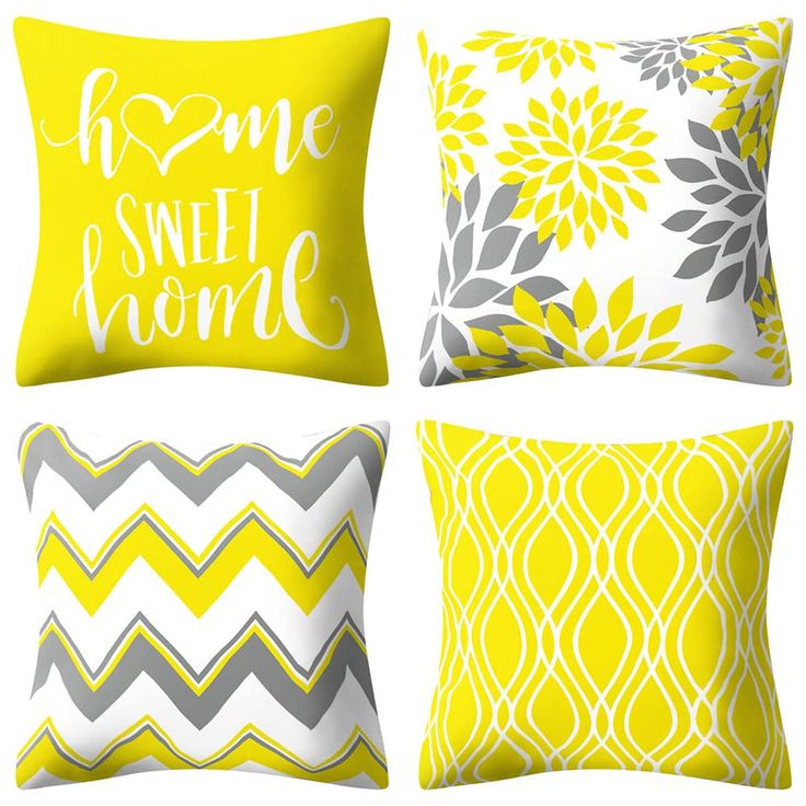 four yellow and gray pillows with the words home sweet home written on each pillow cover