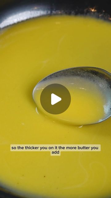 a spoon full of yellow liquid sitting on top of a bowl with a quote about how to use it