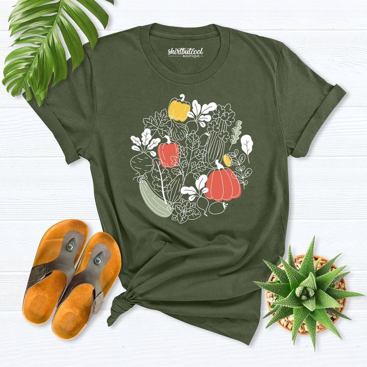 vegetable garden shirt, Cottagecore Clothing, Plant Aesthetic Shirt, Farmer Shirt, Vegetable Print Shirt, Gardening T-Shirt, Gardener Shirt Hello! Thank you for supporting small businesses. My main priority here is the satisfaction of my customers. Fruit Lemon shirts are Bella+Canvas brand. If Bella+Canvas is out of stock, I will send it from a brand of the same size and quality. If you want to see this design on the SWEATSHIRT you can buy it from the link below.https://etsy.me/3LS0Viz Fruit Lem Casual Fall Shirt With Plant Print, Green Tops With Plant Print For Fall, Organic Green Short Sleeve Top, Relaxed Fit Graphic Print Shirt For Gardening, Relaxed Fit Shirt With Graphic Print For Gardening, Green T-shirt With Plant Print For Gardening, Summer Cotton Shirt For Gardening, Green Relaxed Fit Shirt With Plant Print, Relaxed Fit Green Shirt With Plant Print