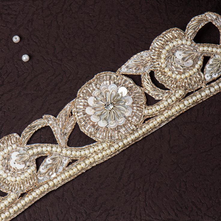 Beautiful Light Golden Zardozi Glass Bead and Pearl Floral Lace Trim | Embroidered Cut-Work Ribbon for Wedding Sash, Dress Embellishment This beautiful Lace can be used for designing stylish blouses, shrugs, skirts, tunics, festive wear, wedding wear and dresses. This stunning lace trim is great for any sewing and craft projects. A perfect embellishment for a bridal dresses or for any festive mood outfit. Our lace will add mystique to your fabric, you can use this lace alone or add it with other laces to create a new unique design for, any of your project : ➤dress border, dupattas, scarves and veils ➤jewelry making, ➤for making a DIY belt ➤designing stylish blouses, ➤waist belt to match your plain outfit ➤festive wear, wedding wear, dresses ➤Embellish your clutch purses ➤Can also be incorp Elegant Gold Embroidered Bridal Belt, Elegant Embroidered Bridal Belt For Wedding, Festive Gold Embellished Bridal Belt, Gold Embellished Bridal Belt For Festive Occasion, Festive Gold Embroidered Bridal Belt, Elegant Bridal Belt For Wedding And Festive Occasions, Festive Embroidered Bridal Belt For Wedding, Festive Embroidered Bridal Belt, Traditional Embroidered Bridal Belt For Wedding