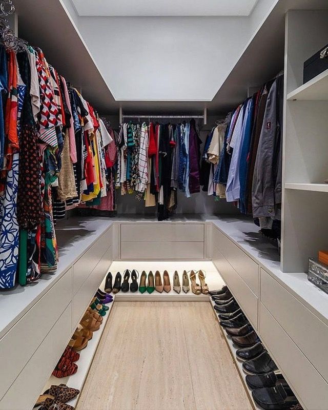 an organized closet with shoes and scarves