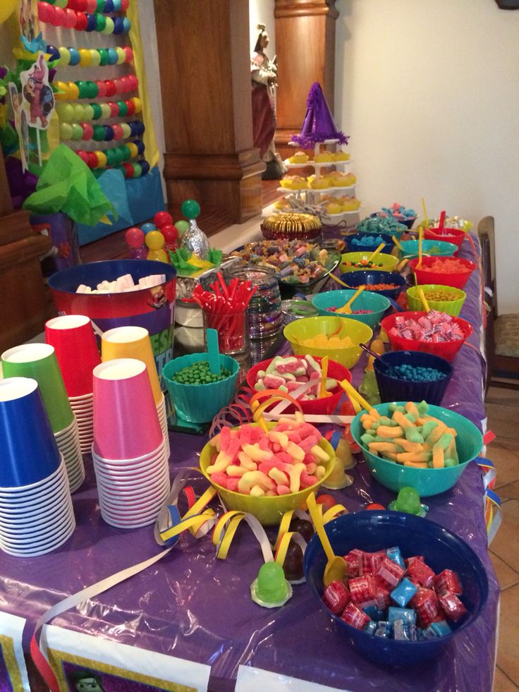 the table is covered with many different types of candy