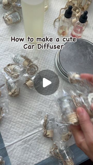 someone is making a cute car diffuser out of seashells and other shells