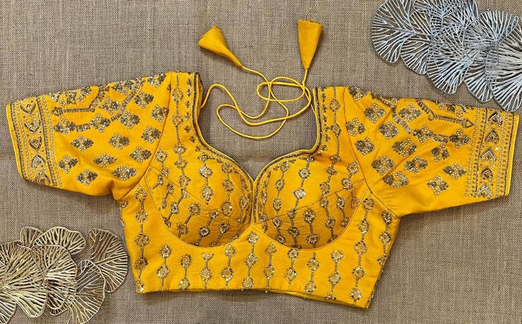 Buy yellow heavy embroidery choli-cut saree blouse online in USA. Elevate your saree style with exquisite readymade saree blouses, embroidered saree blouses, Banarasi sari blouse, designer saree blouse, choli-cut blouses, corset blouses from Pure Elegance Indian fashion store in USA.-front Party Yellow Embroidered Choli, Yellow Cutdana Traditional Wear Fitted, Fitted Yellow Saree Traditional Wear, Yellow Fitted Saree Traditional Wear, Fitted Yellow Traditional Wear With Cutdana, Yellow Fitted Traditional Wear With Cutdana, Yellow Resham Embroidery Blouse Piece For Diwali, Yellow Bollywood Blouse With Resham Embroidery, Diwali Yellow Blouse Piece With Resham Embroidery