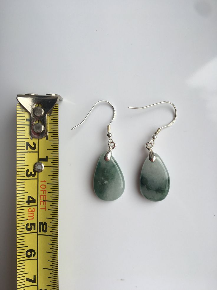 A pair of real green&white jade teardrop earrings with 925 Sterling Silver hook. The simple and delicate teardrop earrins are carved from Grade-A quality green icy jade. The jade color is all-natural and genuine, clear jade texture can be easily observed under the daylight. Some highlights of this pair of minimalistic jade earrings: *High quality guaranteed. Grade-A natural green jade, handmade with 925 sterling silver. *Graceful and simple teardrop design *Each teardrop is measured around 1 Green Teardrop Drop Earrings Nickel Free, Green Nickel-free Teardrop Drop Earrings, Green Nickel-free Teardrop Earrings, Green Teardrop Drop Earrings For Jewelry Making, Green Teardrop Jewelry With Ear Wire, Jade Drop Earrings With Ear Wire, Green Drop Jewelry For Jewelry Making, Nickel-free Green Drop Jewelry, Green Nickel-free Drop Jewelry