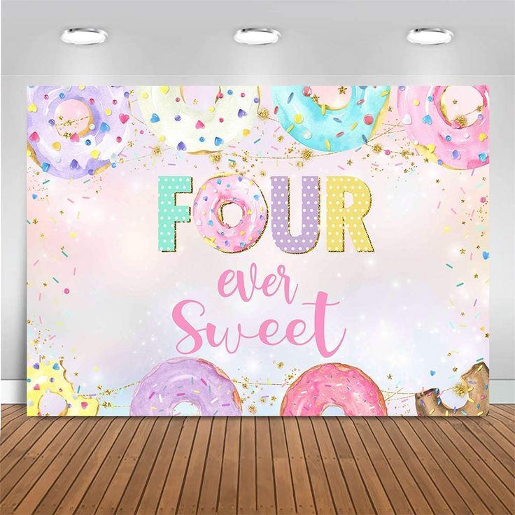 a wall mural with donuts and sprinkles that says four ever sweet