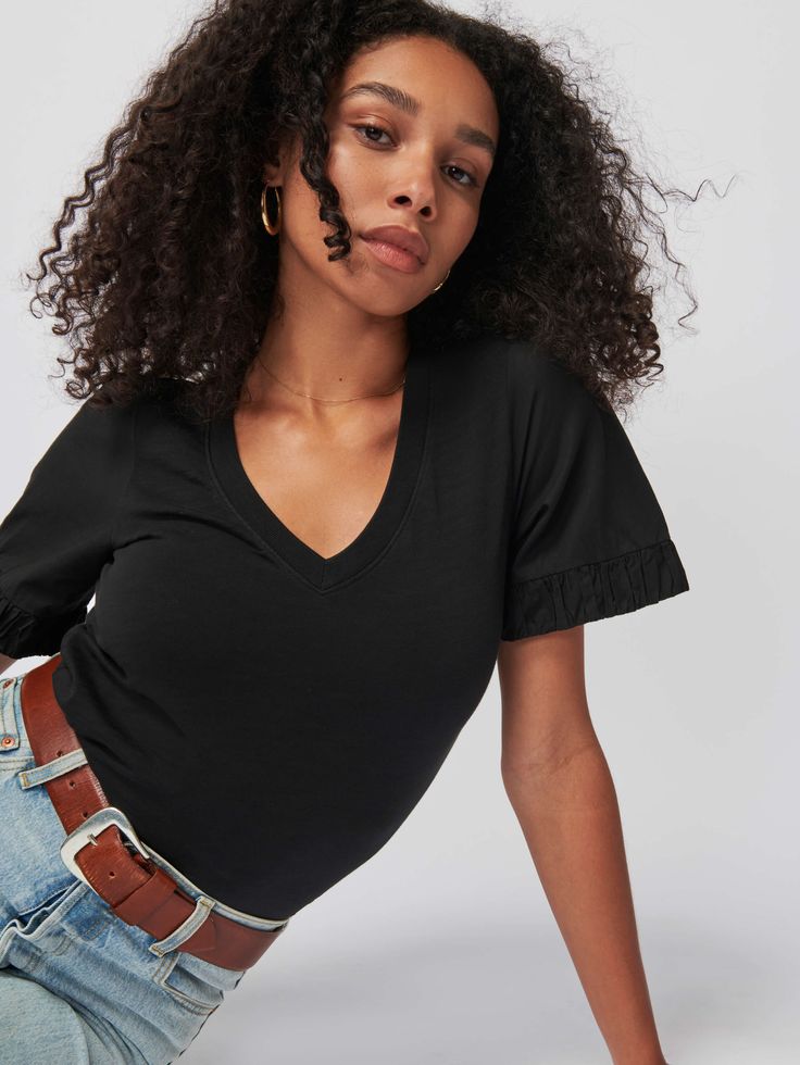 A softer, rounded V neck with a slightly puffed shoulder and Pima cotton Poplin elastic trim on the cuffs. It's the elevated essential you didn't know you needed. (This one comes in Jet Black.) | Sedona Top in Jet Black | Ethical Essentials Casual Solid Tops With Elastic Sleeves, Chic Spring Tops With Elastic Cuffs, Casual Tops With Elastic Sleeves And Relaxed Fit, Casual Tops With Elastic Sleeves Relaxed Fit, Trendy Tops With Elastic Cuffs And Relaxed Fit, Black Tops With Elastic Sleeves Casual, Trendy Cotton Tops With Elastic Sleeves, Black Casual Tops With Elastic Sleeves, Relaxed Fit Tops With Elastic Cuffs