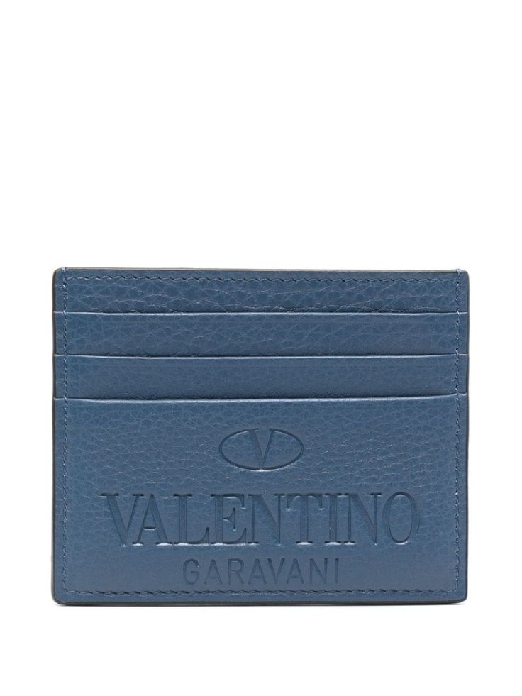 indigo blue calf leather grained texture debossed logo to the front rectangle shape card slots This piece comes complete with a protective dust bag. Designer Blue Card Holder For Everyday, Designer Wallets With Engraved Logo For Professional Use, Designer Business Wallets With Engraved Logo, Designer Rectangular Card Holder With Logo, Designer Blue Wallets For Business, Designer Blue Business Wallets, Modern Rectangular Card Holder With Logo Plaque, Elegant Rectangular Logo Card Holder, Luxury Leather Embossed Wallets