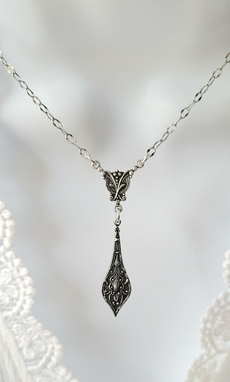 Adorn yourself with this beautifully detailed and embossed pendant necklace. This necklace is beautiful to wear alone or mix with other necklaces.  * The drop from the centerpiece is 1-1/4 inches long. * Please see photo guide for the length you prefer and for size of pendant and drop.  * Stainless steel non tarnish beautiful chain. Sterling silver clasp.   All my jewelry is free of lead, free of nickel.  Materials sourced from The USA, Italy , Spain , Portugal and The United Kingdom.    All my jewelry is designed for you to express yourself and your life with happiness , beauty and spirit. Edwardian Era Jewelry, Victorian Era Jewelry, Victorian Aesthetic, Spain Portugal, Necklace Antique, Gilded Age, Embossed Design, Vintage Bride, Edwardian Era