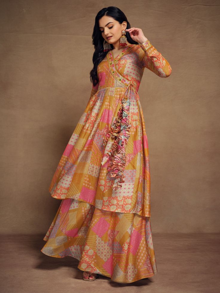 Add a touch of elegance and sophistication to your wardrobe with our glamorous mustard yellow digital printed muslin silk palazzo suit. This stunning outfit is perfect for any special occasion, from events and functions to festivals and celebrations. The mustard yellow color adds a vibrant pop to your look, while the digital print work gives it a modern and chic touch.
Crafted from high-quality muslin silk, this palazzo suit is luxurious and comfortable to wear. The intricate embroidery work add Yellow Anarkali Set With Printed Motifs, Yellow Anarkali Set With Straight Kurta And Printed Motifs, Yellow Anarkali Palazzo Set With Printed Motifs, Yellow Printed Motifs Anarkali Set For Festivals, Yellow Chanderi Sharara With Printed Motifs, Anarkali Sets With Printed Motifs In Yellow, Yellow Anarkali Set With Printed Motifs For Festivals, Yellow Anarkali Set With Printed Motifs For Navratri, Festive Floor-length Palazzo Set With Printed Motifs