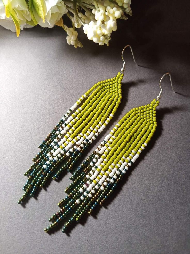 Elegant Green Beaded Earrings With Tassels, Elegant Green Beaded Fringe Tassel Earrings, Green Fringe Round Bead Earrings, Green Fringe Beaded Drop Earrings, Handmade Green Bohemian Tassel Earrings, Bohemian Green Beaded Fringe Earrings, Green Beaded Fringe Tassel Earrings Gift, Green Tassel Earrings With Beaded Fringe, Green Beaded Earrings With Fringe For Summer