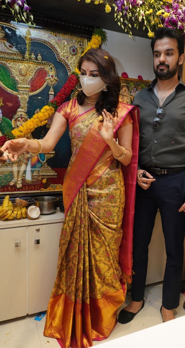 two people standing next to each other wearing masks