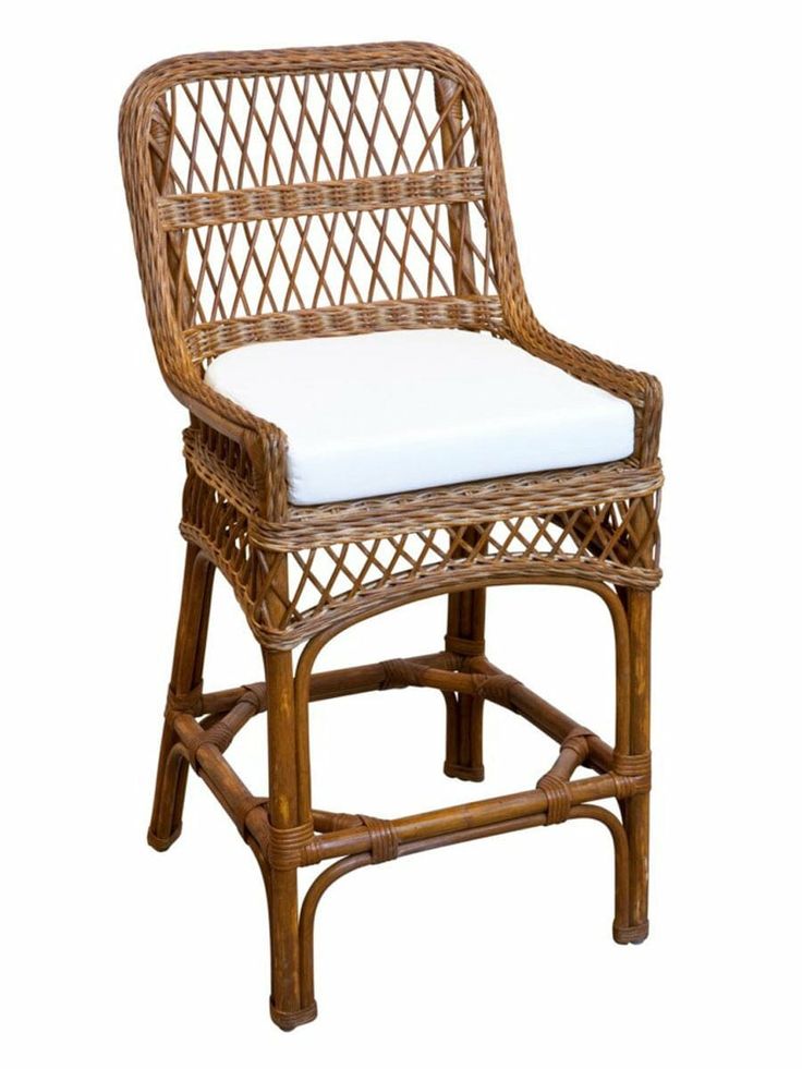 a wicker chair with a white cushion