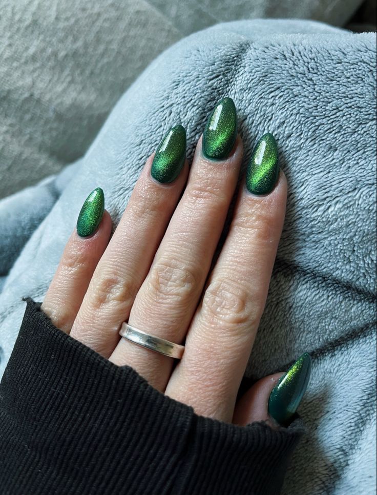 Green Sparkles Nails, Emerald Green Nails For Homecoming, Emerald Green Magnetic Nails, Green Cat Eye Acrylic Nails, Emerald Green And Black Ombre Nails, Emerald Green Pearl Nails, Green Cat Eye Nails Short, Emerald Gel Nails, Green Jelly Cat Eye Nails