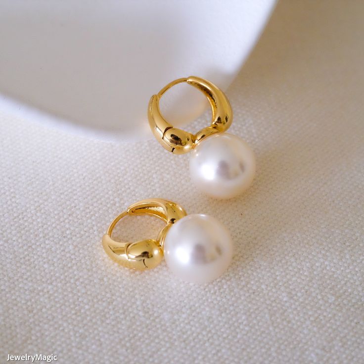 These dainty 12mm white pearl earrings, elegantly finished with 18k gold, are a chic accessory perfect for bridesmaids, everyday wear, or as a thoughtful gift for her. The classic white pearls add a touch of sophistication and femininity, making these earrings an ideal choice for special occasions such as weddings, anniversaries, and birthdays, or for enhancing any everyday outfit. Crafted with high-quality materials, these earrings are hypoallergenic, ensuring comfort for sensitive ears. Beauti Delicate White Gold Plated Pearl Earrings, Elegant Pearl White Hoop Earrings, Delicate White Hoop Earrings For Formal Occasions, Elegant White Pearl Drop Hoop Earrings, Wedding Gold Plated Hoop Earrings With Pearl Drop, Delicate White Gold-plated Pearl Earrings, Formal White Gold Plated Pearl Earrings, Formal White Gold-plated Pearl Earrings, White Gold Plated Round Bridal Earrings