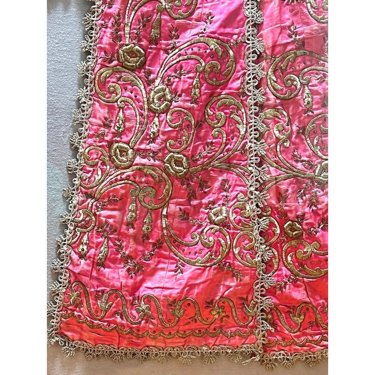 A stunning antique Turkish silk satin robe having rich embellishments of raised hand-embroidered floral motifs in metallic thread, with additional accents of beads and metal sequins on a delicious shade of shimmering pink, it is a beautiful colour pop room decor.  Circa 1850 - 1899. Framed in acrylic shadow box. Embellished Pink Silk Traditional Wear, Pink Embellished Silk Traditional Wear, Festive Silk Dupatta With Gold Embroidery, Pink Raw Silk Dupatta With Intricate Embroidery, Traditional Drape Pink Embroidered Fabric, Pink Embroidered Fabric With Traditional Drape, Embellished Pink Art Silk Dupatta, Pink Embellished Art Silk Dupatta, Pink Embellished Dupatta For Festivals