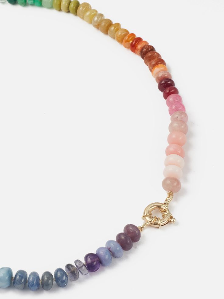 The Encirkled Rainbow Gemstone Necklace is a cult favorite and a classic Encirkled piece- the ultimate addition to your neck stack. This piece includes bright colored rainbow gemstones featuring a 14k spring ring closure, that is perfect for displaying your favorite charms. 8mm assorted gemstones that may include amethyst, apatite, aquamarine, aventurine, carnelian, chrysoprase, emerald, fluorite, kyanite, lemon quartz, Peruvian opal, pink moonstone, lepidolite, iolite, chrysocolla, goldstone, m Multicolor Single Strand Round Jewelry, Everyday Rainbow Round Jewelry, Multicolor Round Necklaces For Everyday, Multicolor Round Jewelry With Lobster Clasp, Multicolor Multi-stone Rondelle Jewelry, Multicolor Single Strand Rondelle Jewelry, Multicolor Rondelle Single Strand Jewelry, Rainbow Round Gemstone Beads Jewelry, Multicolor Gemstone Rondelle Jewelry