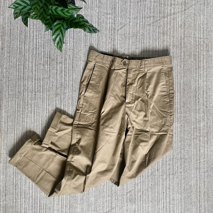 Brand New With Tags Tan Pleated Khakis, Perfect For That Trendy Summer Look With A Rolled Sleeve Tee, Open Linen Button Down, Birkenstocks, And Round Sunglasses. The Kind That Should Be Worn In Italy Or New York City. Tab Button Closure. Has Approx. A 13in Rise And 31in Inseam (Cuffed) Or 32.5in Uncuffed. Counter Offers Encouraged Khaki Work Pants With Pockets For Workwear, Khaki Work Pants With Pockets, Khaki Utility Bottoms For Workwear, Khaki Work Pants With Side Pockets, Fitted Khaki Cargo Pants With Welt Pockets, Khaki Utility Pants For Work, Utility Pants With Button Closure For Workwear, Fitted Utility Pants With Button Closure, Beige Utility Bottoms For Workwear