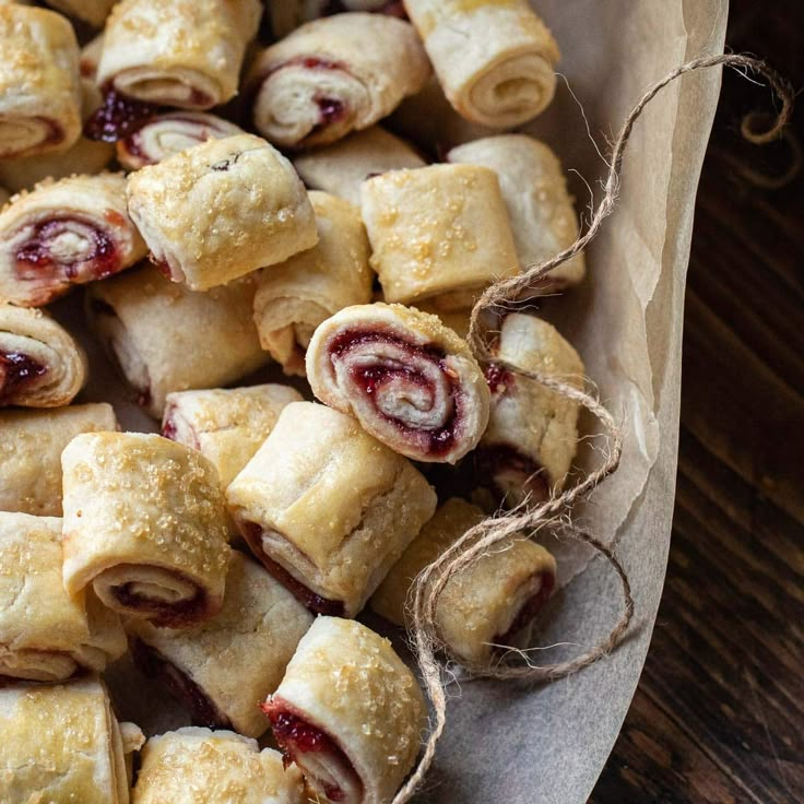 small pastries are wrapped in brown paper