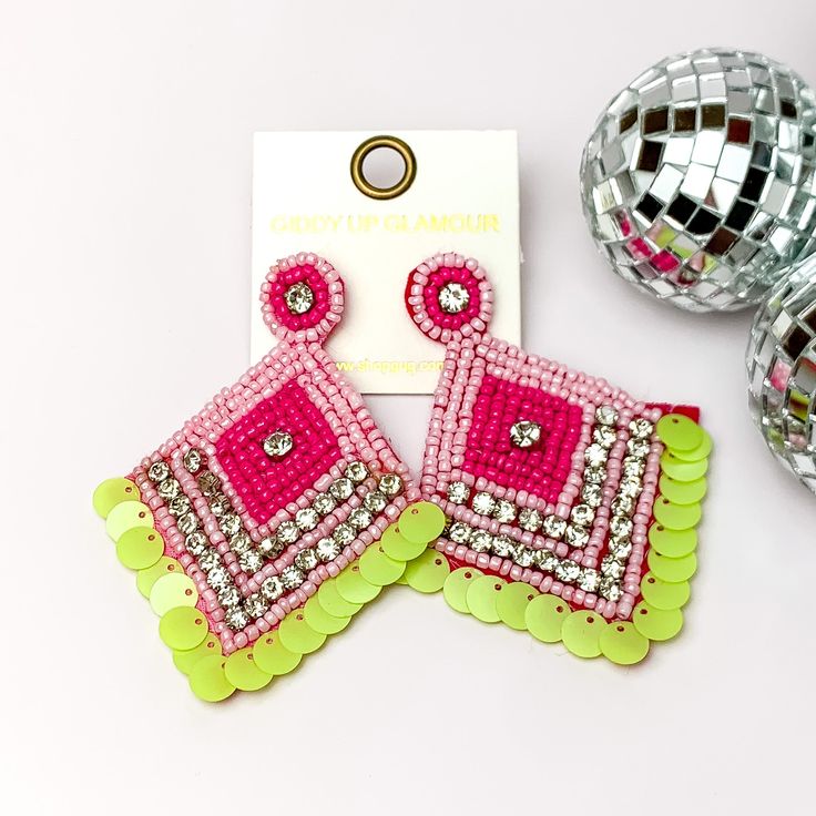 Fashionista Diamond Shaped Beaded Earrings in Pink, and Green. Pictured on a white background with disco balls on the right. Trendy Pink Beaded Earrings, Trendy Pink Beaded Earrings With Round Beads, Embellished Beaded Dangle Earrings For Party, Embellished Dangle Beaded Earrings For Party, Bohemian Pink Chandelier Earrings For Party, Pink Bohemian Chandelier Earrings For Party, Summer Party Beaded Earrings With Dangling Beads, Party Jewelry With Pink Dangling Beads, Summer Party Jewelry With Dangling Beads