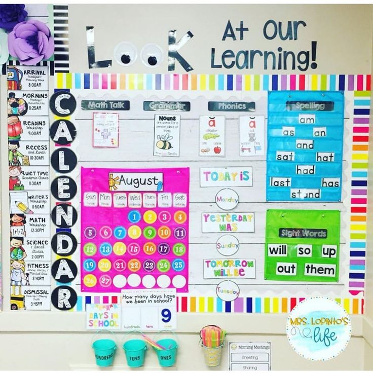 a bulletin board with colorful papers and magnets on it